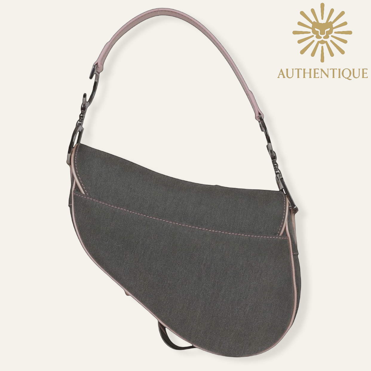 Back of Vintage Christian Dior Saddle Bag in blue denim with pink patent leather trim and silver-tone 'D' charm hardware. Shop Authentique Lux