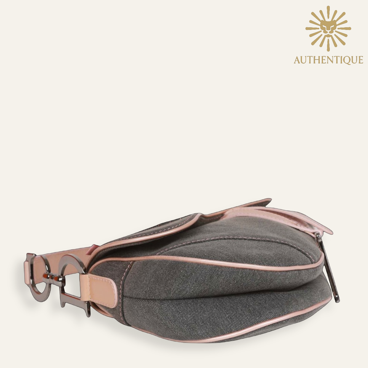 Vintage Christian Dior Saddle Bag in blue denim with pink patent leather trim and silver-tone 'D' charm hardware. Shop Authentique Lux