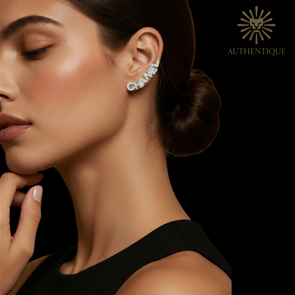 Model wearing Chanel 2022 Strass 'CHA-NEL' Stud Earrings in Gold-Plated Metal with Crystal Embellishments.
