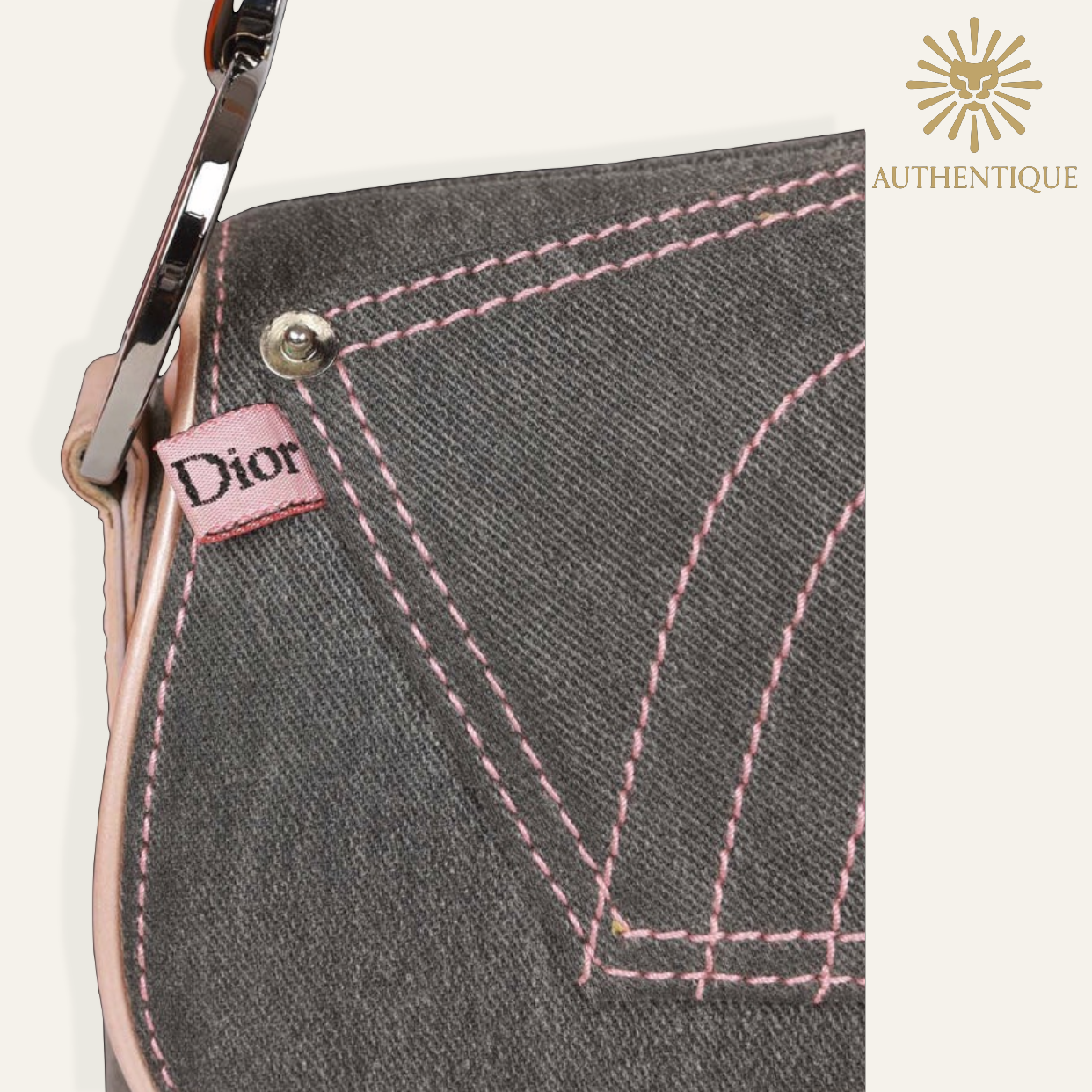 Vintage Christian Dior Saddle Bag in blue denim with pink patent leather trim and silver-tone 'D' charm hardware. Shop Authentique Lux