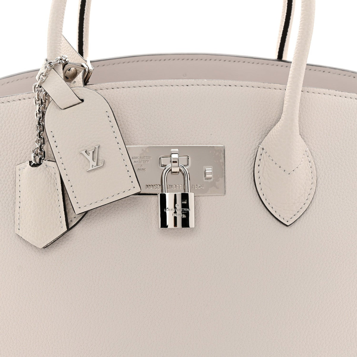 Louis Vuitton Milla MM silver-tone padlock and hanging leather tag | Shop Authentique Lux