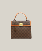 Celine Macadam Blazon top handle bag vintage, visible handle leather wear, good overall condition Authentique Luxury.
Vintage Celine Macadam monogram satchel with minor leather handle flaw.