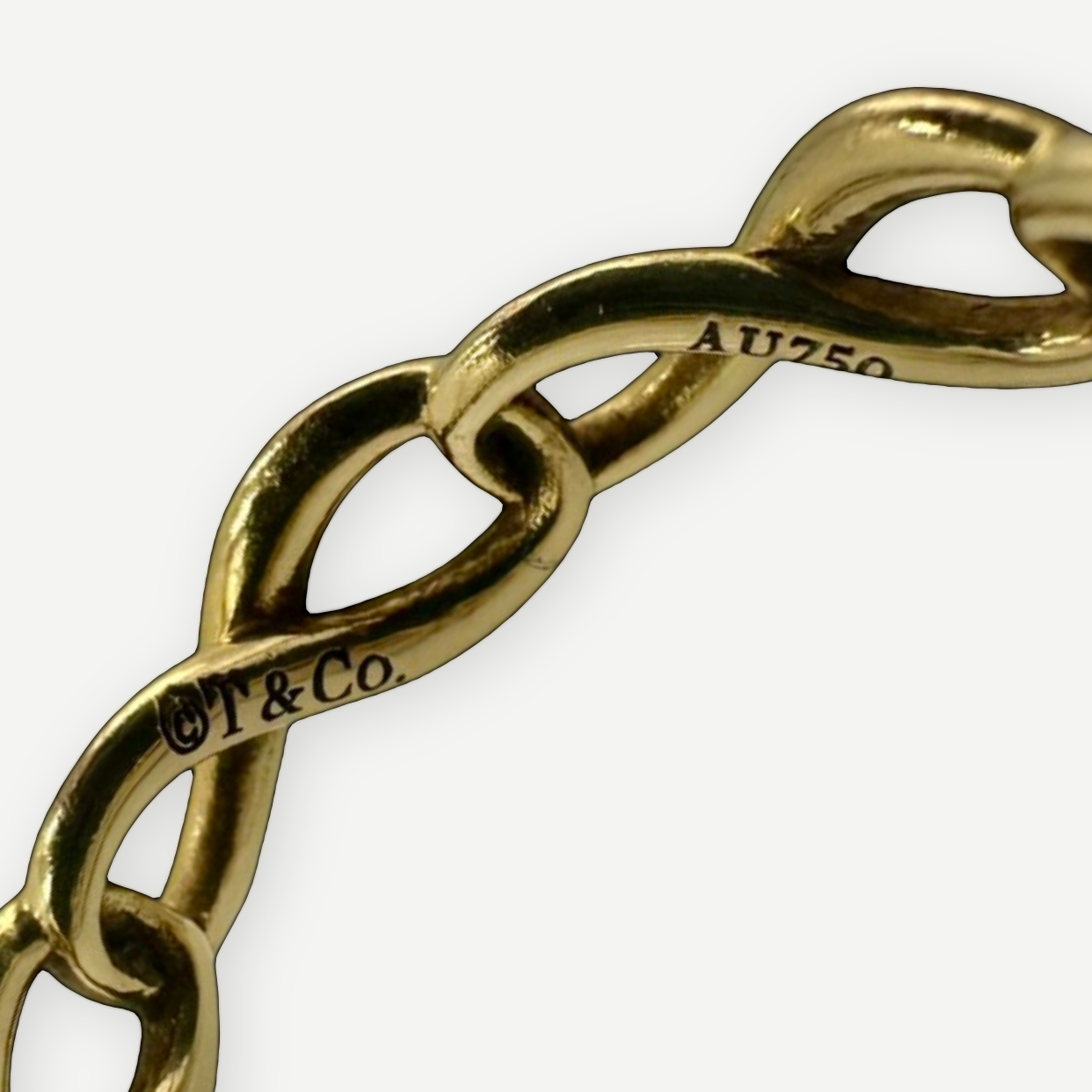Tiffany & Co. Infinity Ring, 18K Yellow Gold, US Size 4.5 | Shop Authentique Lux