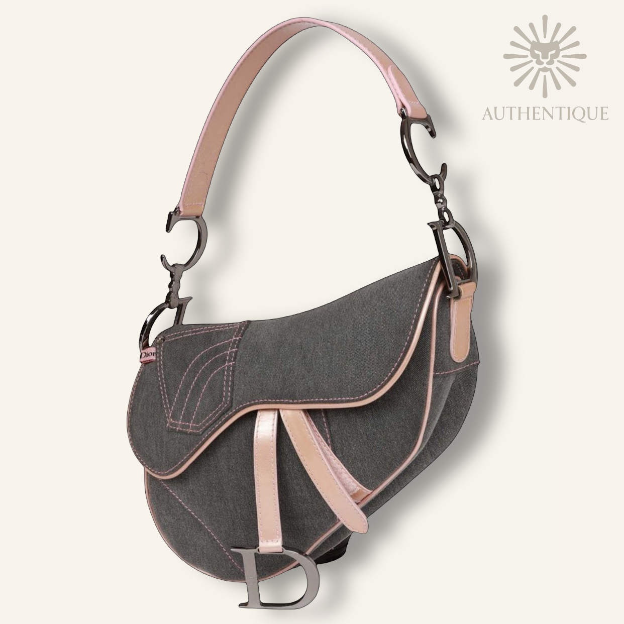 Vintage Christian Dior Saddle Bag in blue denim with pink patent leather trim and silver-tone 'D' charm hardware. Shop Authentique Lux