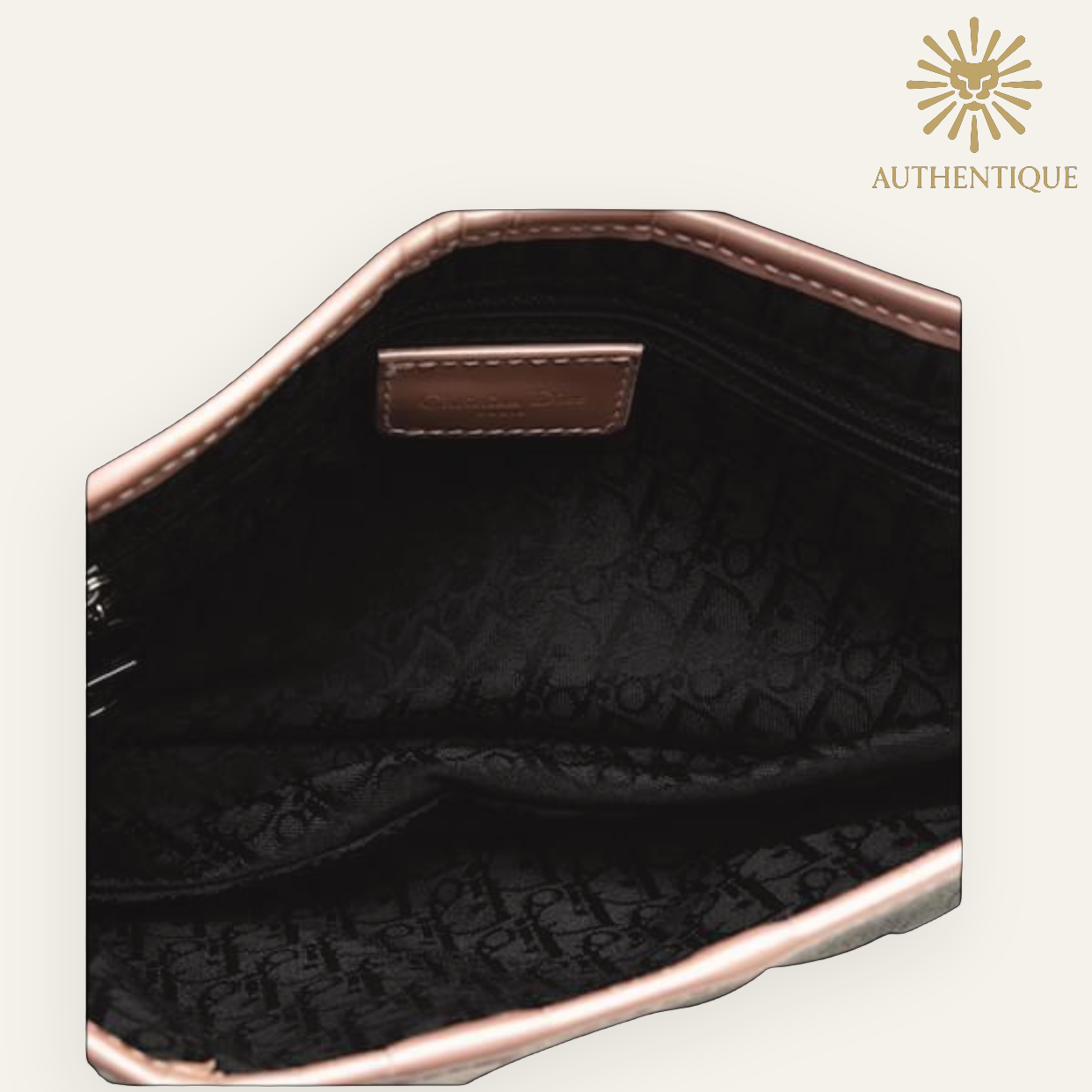 Vintage Christian Dior Saddle Bag in blue denim with pink patent leather trim and silver-tone 'D' charm hardware. Shop Authentique Lux