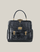 “Valentino Garavani vintage alligator top handle bag authentic Italian exotic luxury”
“Close-up alligator skin detail vintage Valentino Garavani collectible handbag”