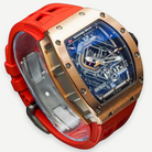 Richard Mille RM 30-01 rose gold watch with red rubber strap, angled view | Shop Authentique Lux