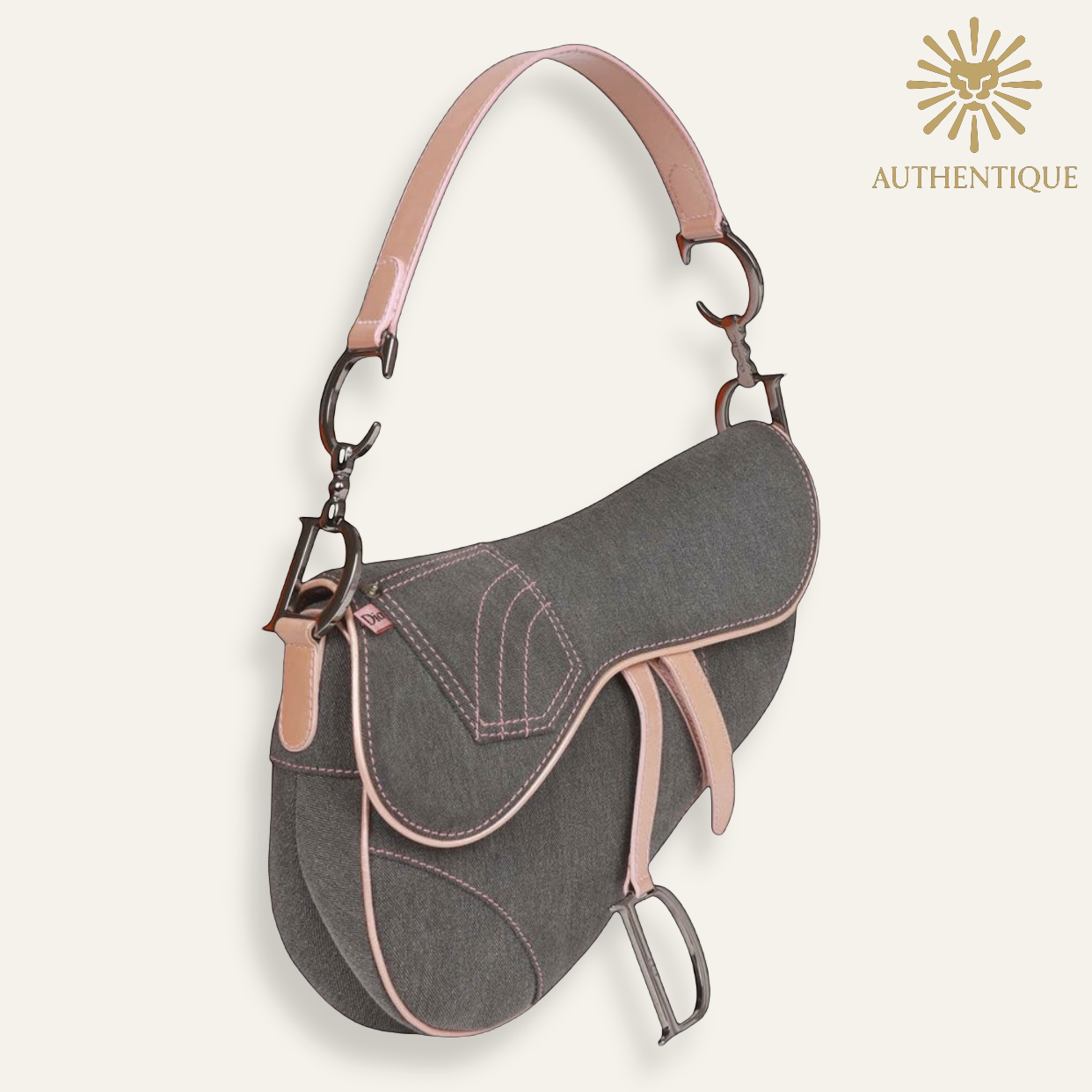 Vintage Christian Dior Saddle Bag in blue denim with pink patent leather trim and silver-tone 'D' charm hardware. Shop Authentique Lux