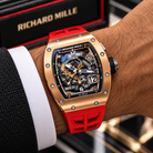 Richard Mille RM 30-01 rose gold watch with red strap worn with tailoring | Shop Authentique Lux