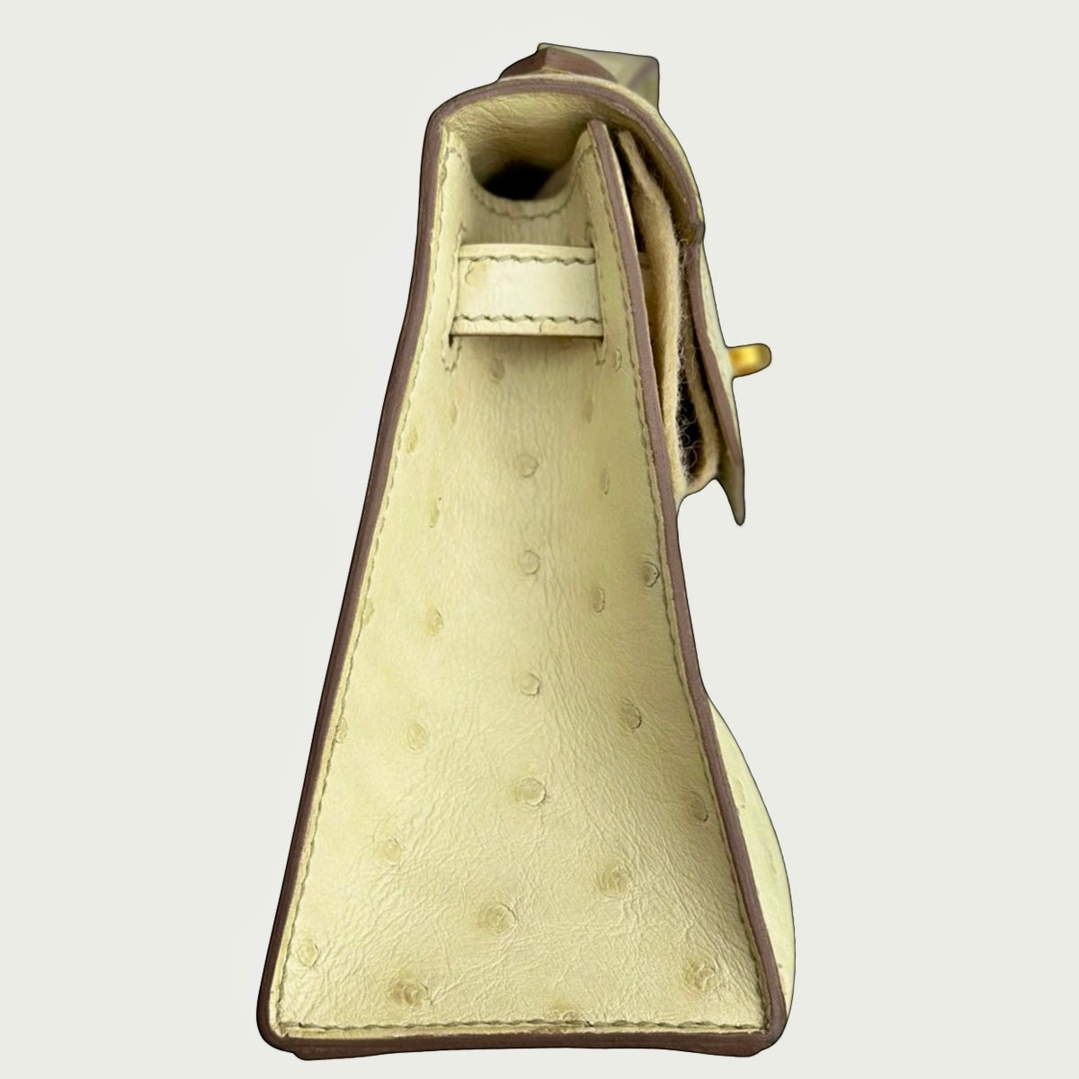 HERMÈS Beton Kelly Pochette, side profile and ostrich quill detail | Shop Authentique Lux