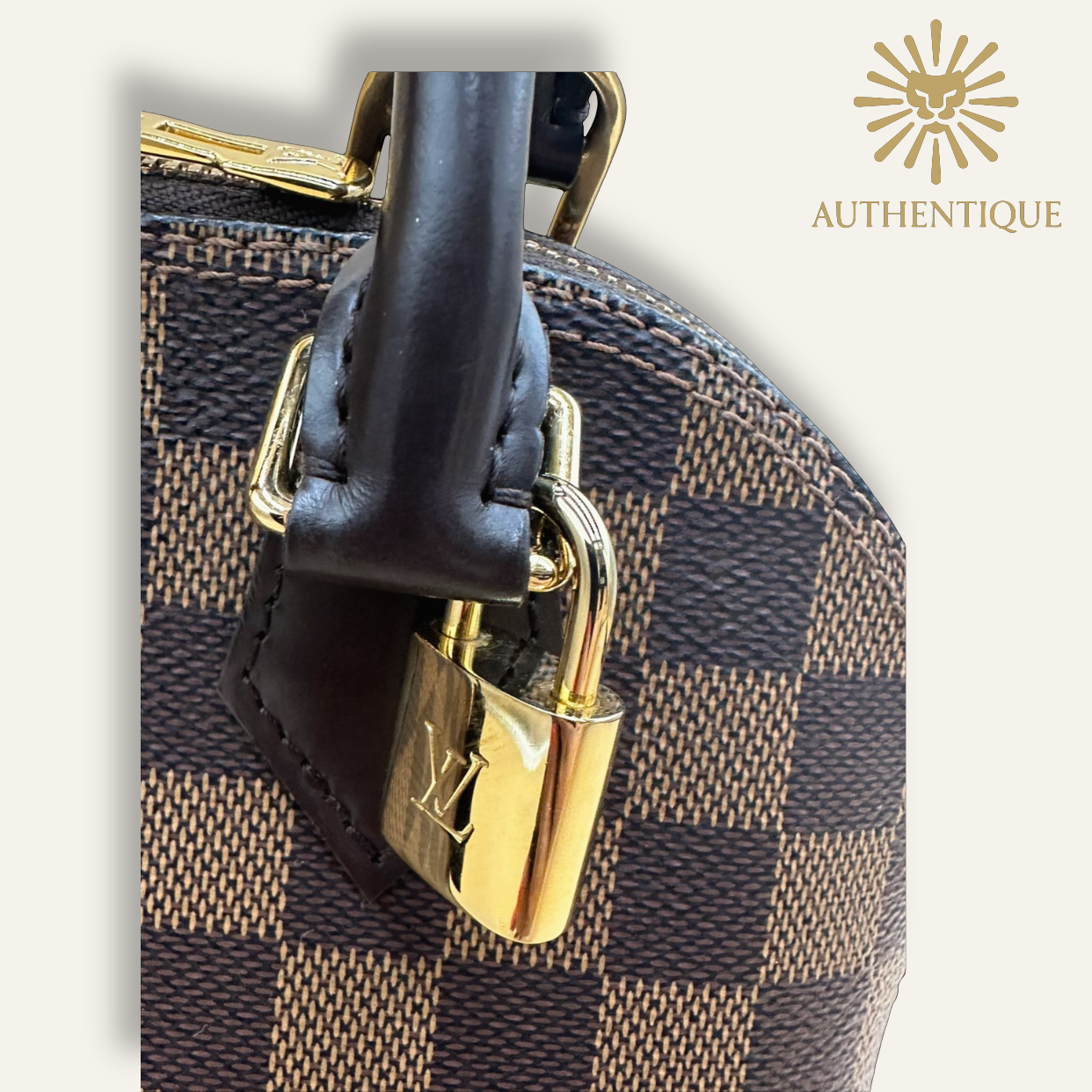 Close up of lock on Louis Vuitton Damier Ebene Alma BB | Shop Authentique Lux