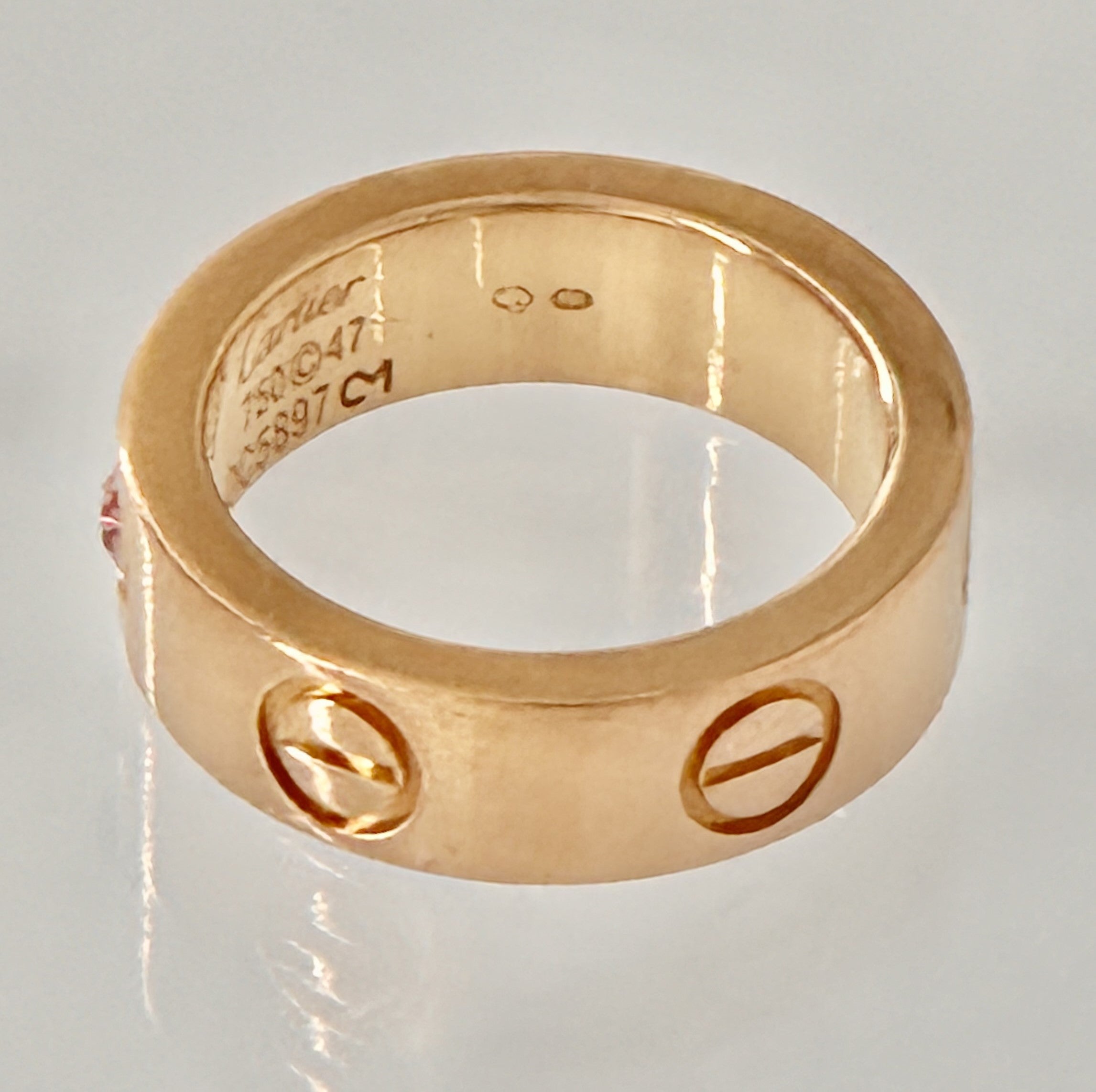 •	“Cartier Love Ring with pink sapphire 18K rose gold size 47 pre-owned authentic”
•	“Authentique Luxury certified Cartier Love Ring pink sapphire rose gold”
