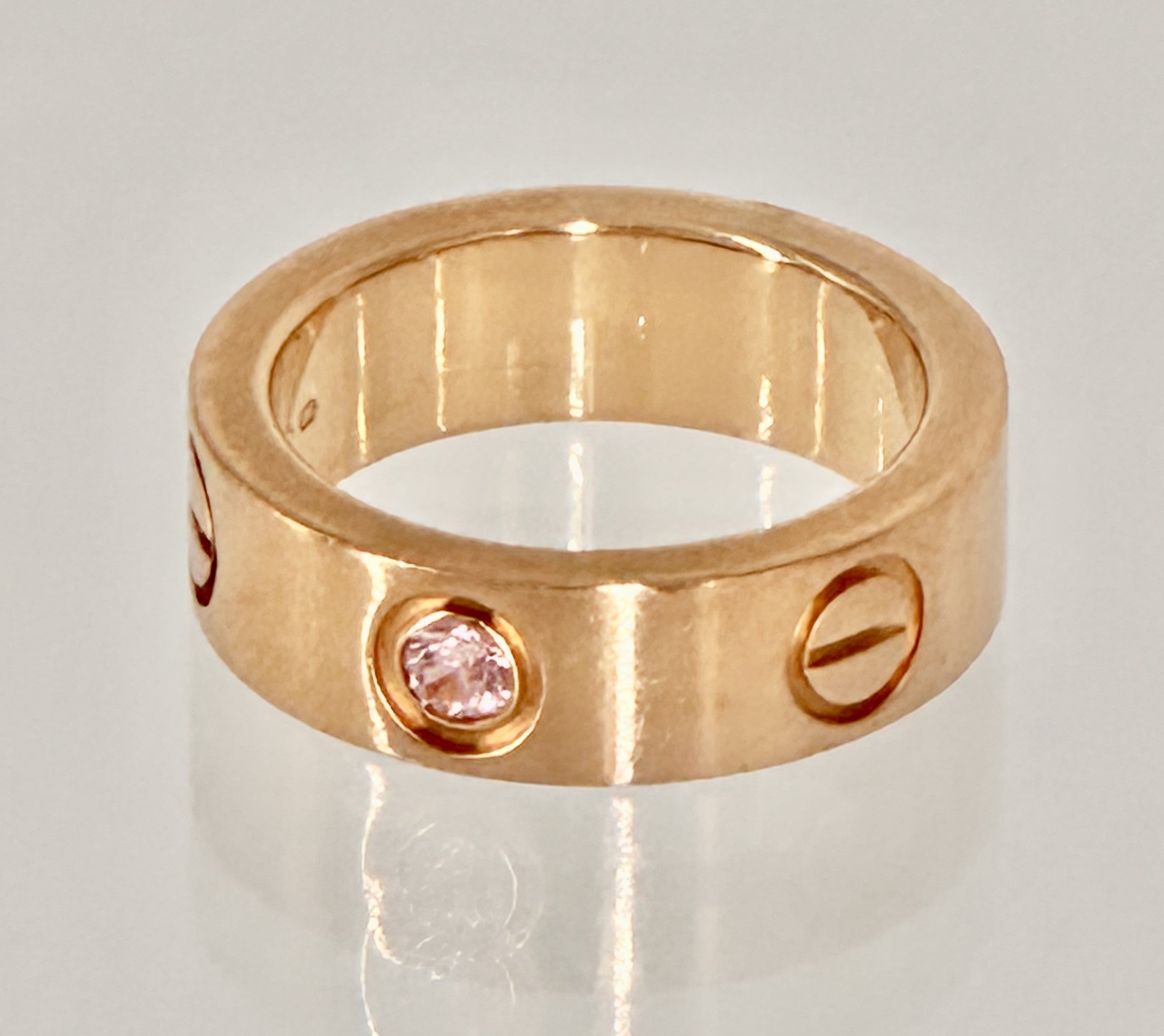 •	“Cartier Love Ring with pink sapphire 18K rose gold size 47 pre-owned authentic”
•	“Authentique Luxury certified Cartier Love Ring pink sapphire rose gold”
