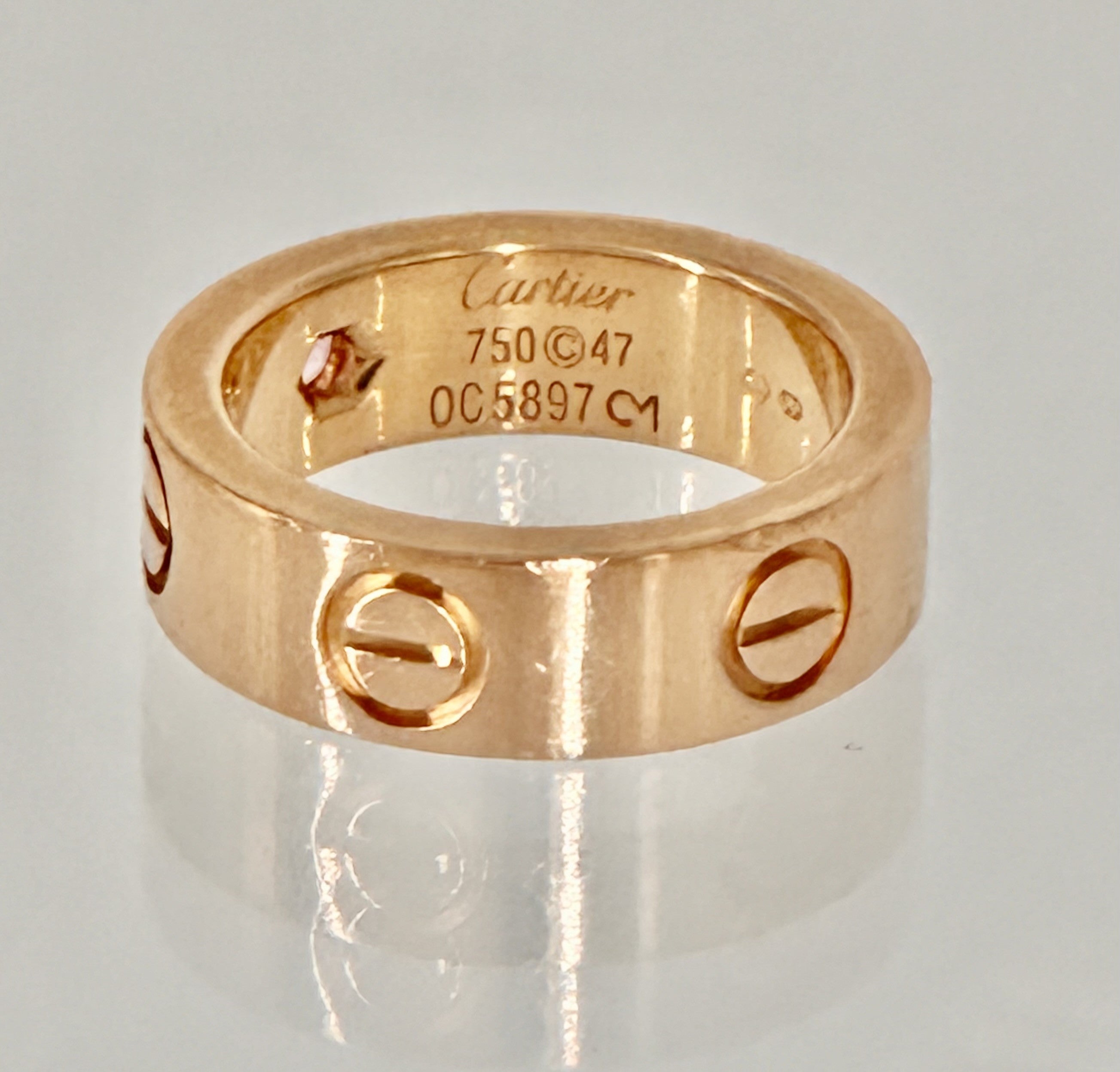 •	“Cartier Love Ring with pink sapphire 18K rose gold size 47 pre-owned authentic”
•	“Authentique Luxury certified Cartier Love Ring pink sapphire rose gold”
