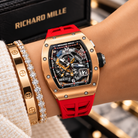 Richard Mille RM 30-01 rose gold watch with red strap styled on wrist | Shop Authentique Lux