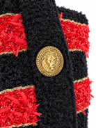 BALMAIN striped knit jacket with gold-tone buttons, angled front view | Shop Authentique Lux