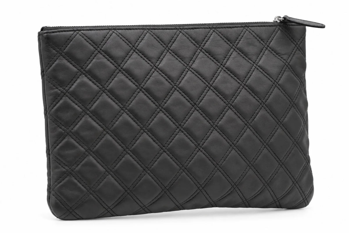 CHANEL black quilted caviar leather O-Case clutch back view | Shop Authentique Lux